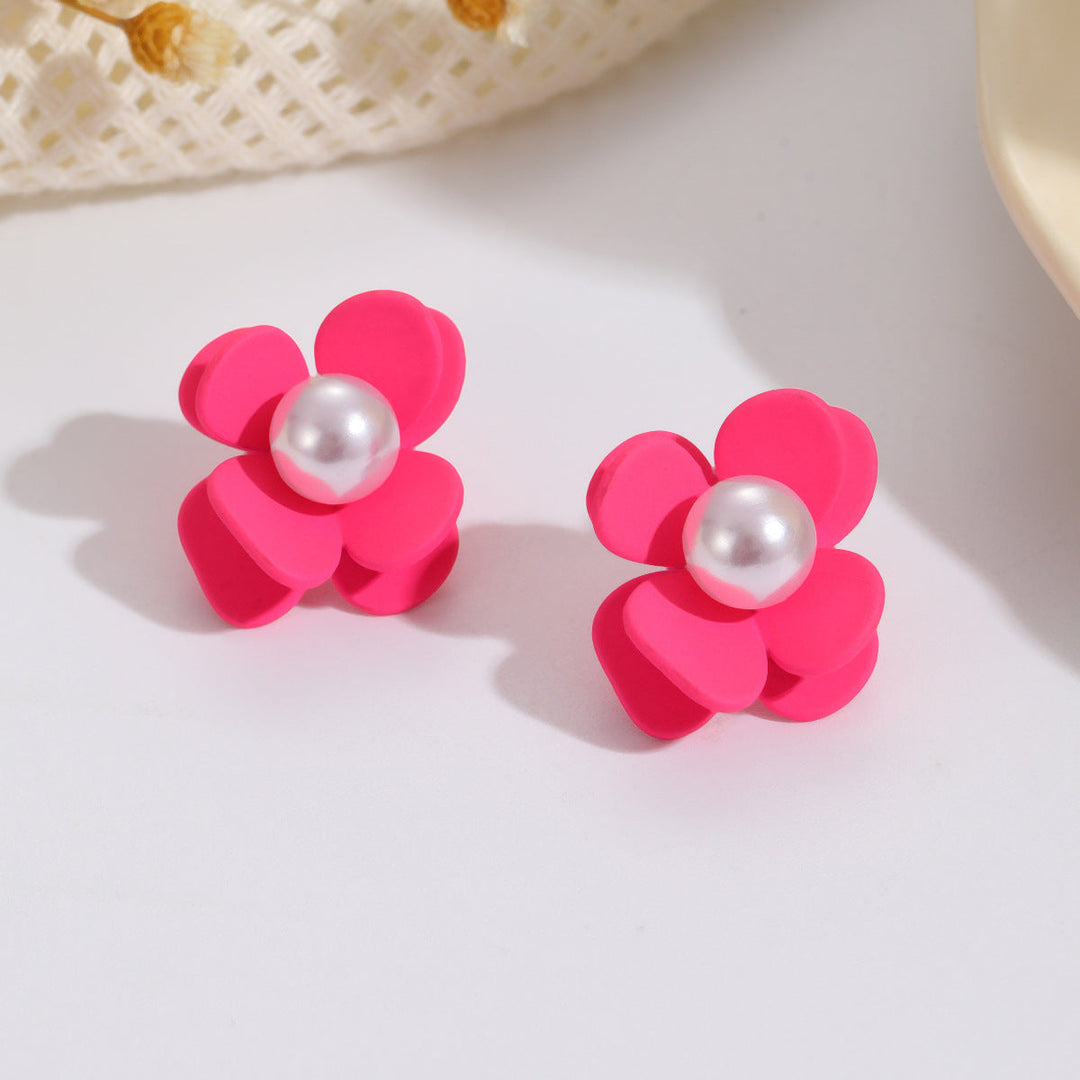 Ladies earrings in vibrant floral design with pearl accent Nin Boutique