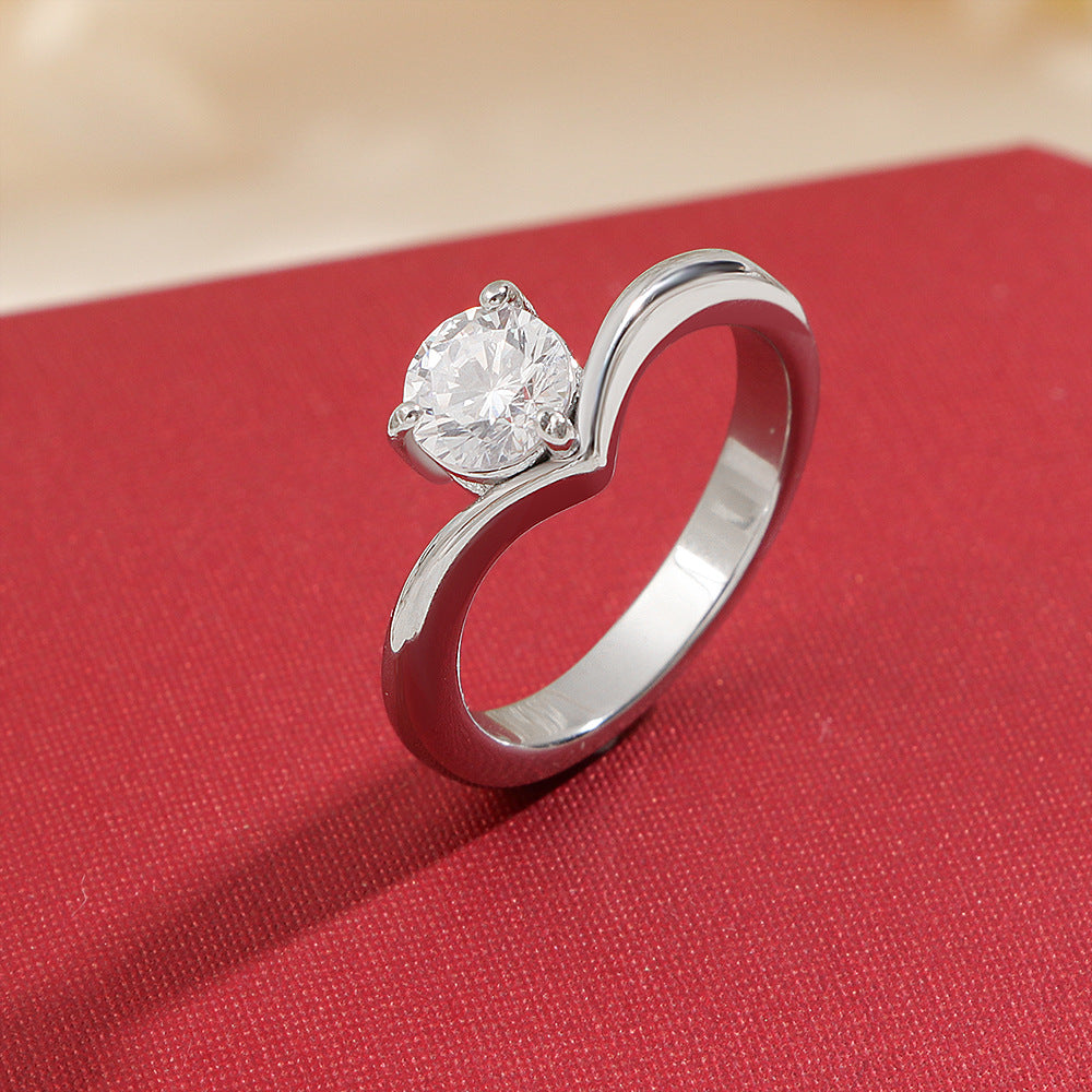 Ladies ring with elegant wave pattern and sparkling zirconia Nin Boutique