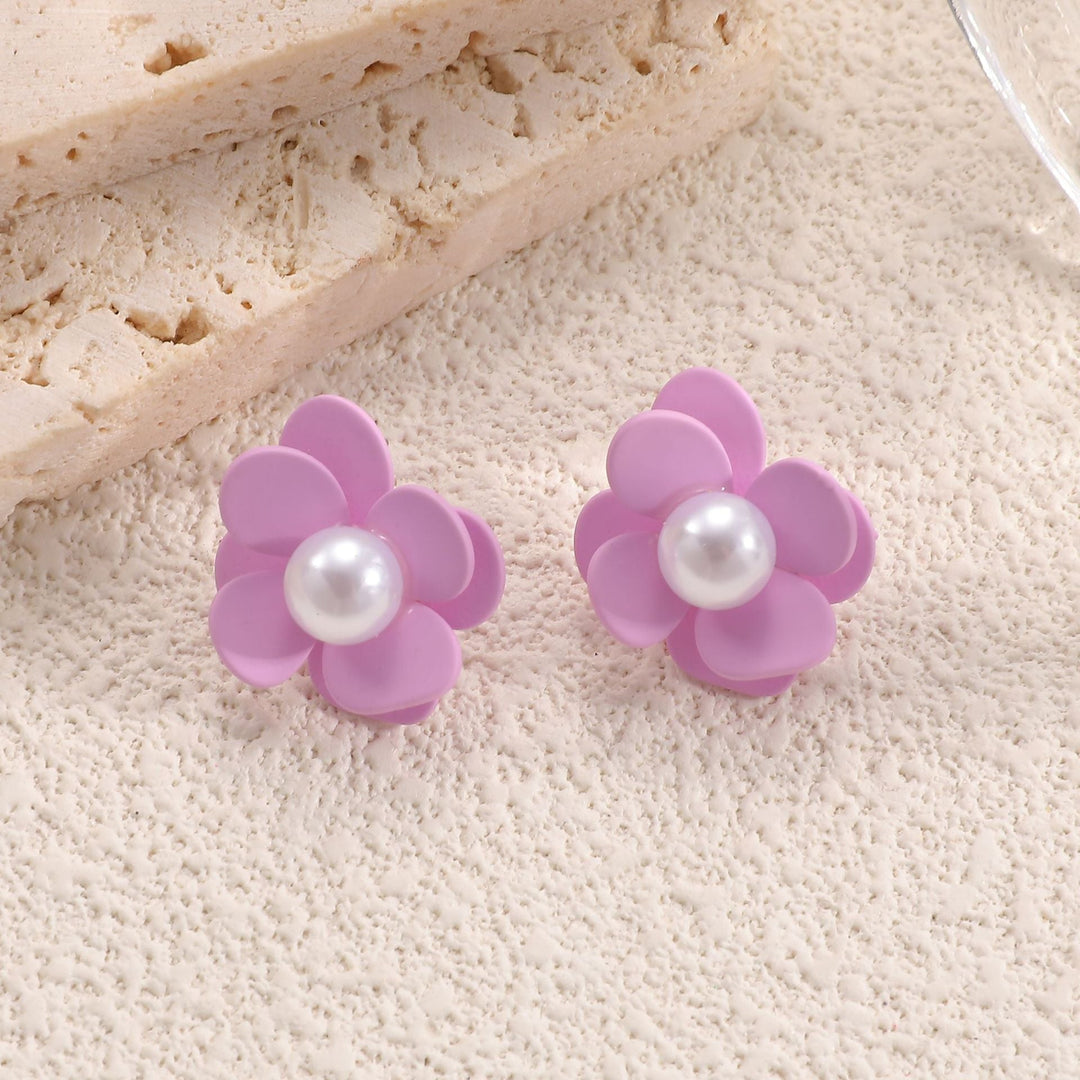 Ladies earrings with playful floral motif and pearl accent Nin Boutique
