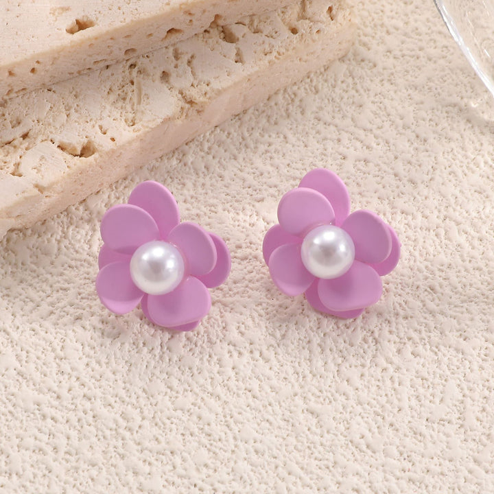 Ladies earrings with playful floral motif and pearl accent Nin Boutique