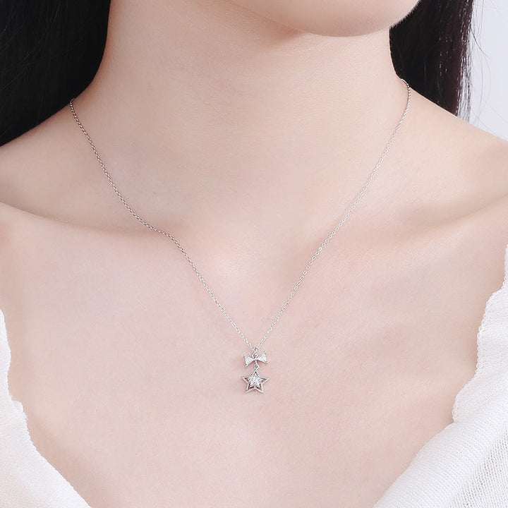 Women's necklace with sparkling star and bow pendant Nin Boutique