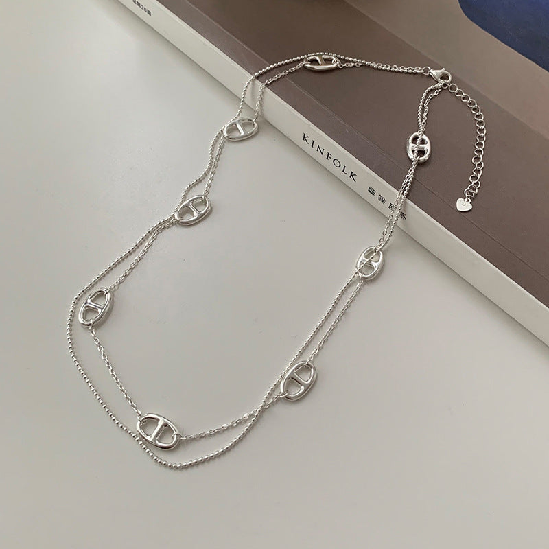Women's necklace with playful link design and elegant detail Nin Boutique