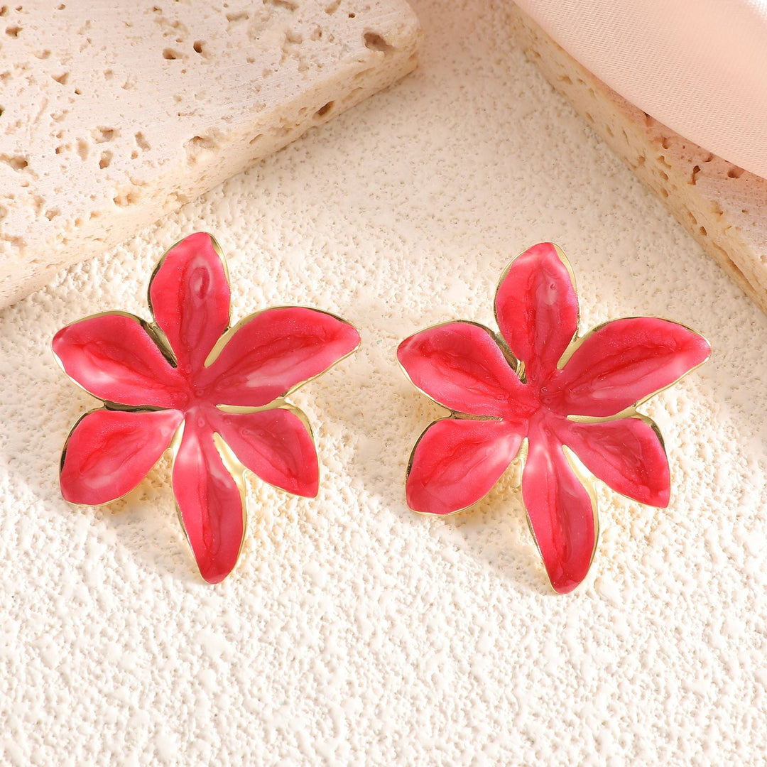 Ladies earrings with floral design and elegant gold rim Nin Boutique