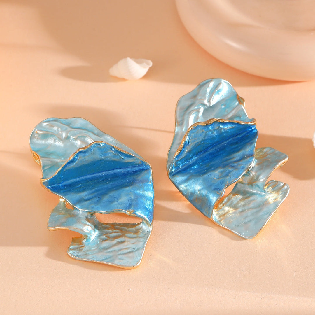 Ladies earrings in elaborate shell design Nin Boutique