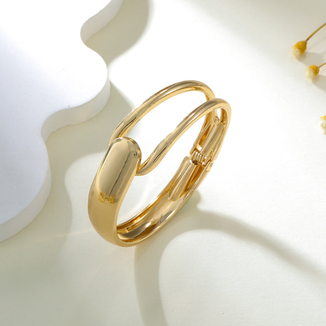 Ladies' bangle with elegant, curved design Nin Boutique