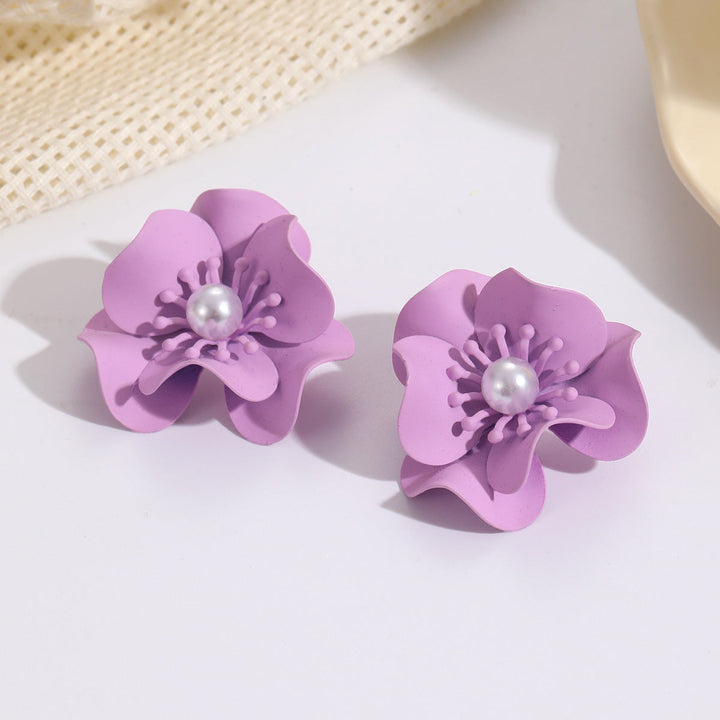 Women's earrings with intricate floral design and pearl accent Nin Boutique