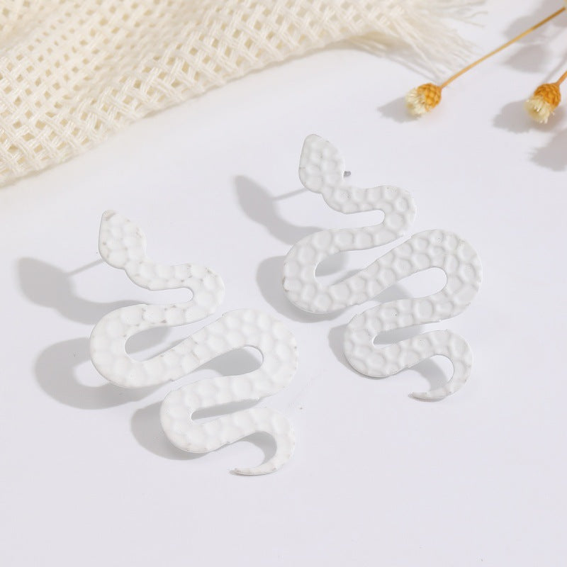 Ladies earrings in artistic snake design Nin Boutique