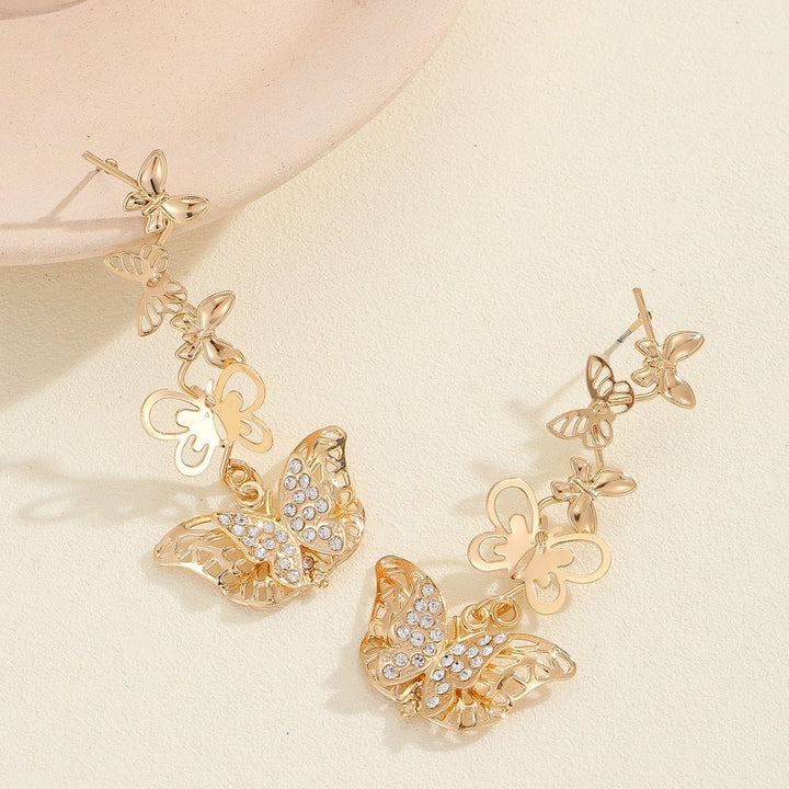 Ladies earrings with elaborate butterfly design Nin Boutique