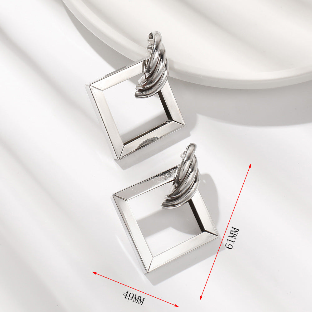 Ladies' earrings in contemporary square ring design Nin Boutique