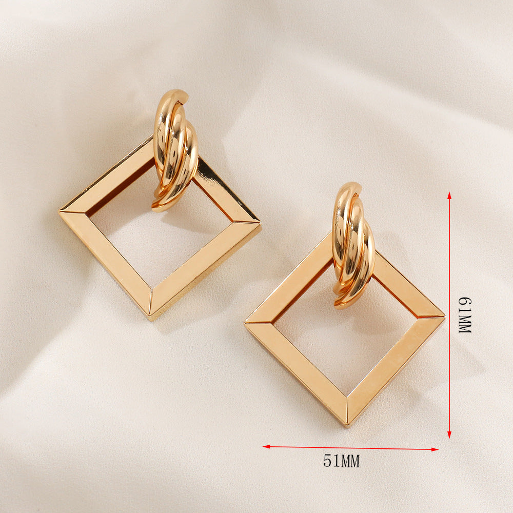 Ladies' earrings in contemporary square ring design Nin Boutique