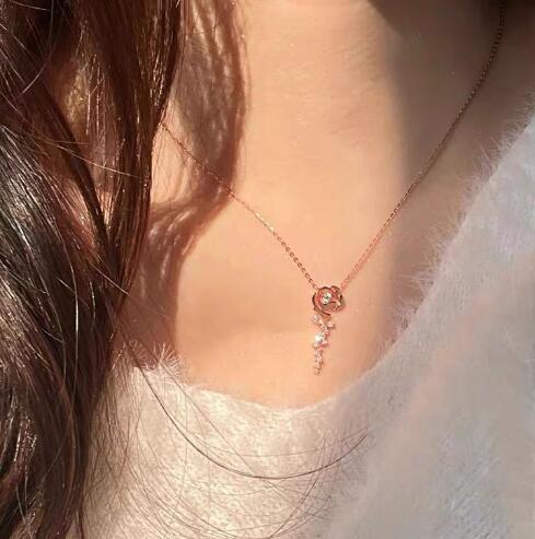 Women's necklace with delicate rose pendant and sparkling accents Nin Boutique