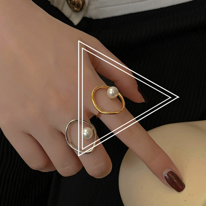 Ladies ring with stylish pearl design and curved frame Nin Boutique