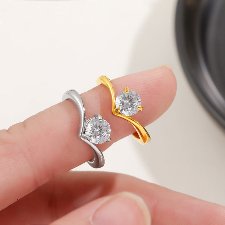 Ladies ring with elegant wave pattern and sparkling zirconia Nin Boutique