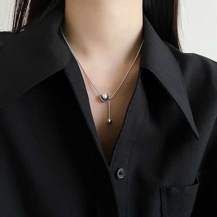 Women's necklace with modern, minimalist design and unique ball details Nin Boutique