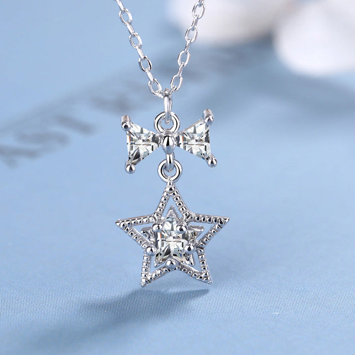Women's necklace with sparkling star and bow pendant Nin Boutique