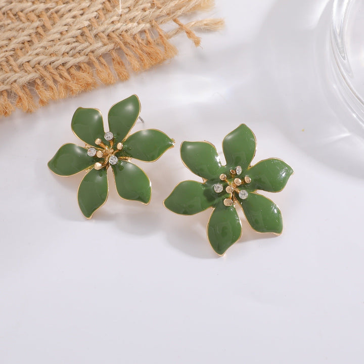 Women's earrings with intricate floral pattern and sparkling accents Nin Boutique