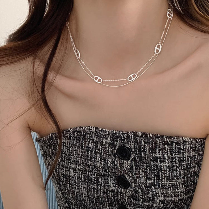 Women's necklace with playful link design and elegant detail Nin Boutique