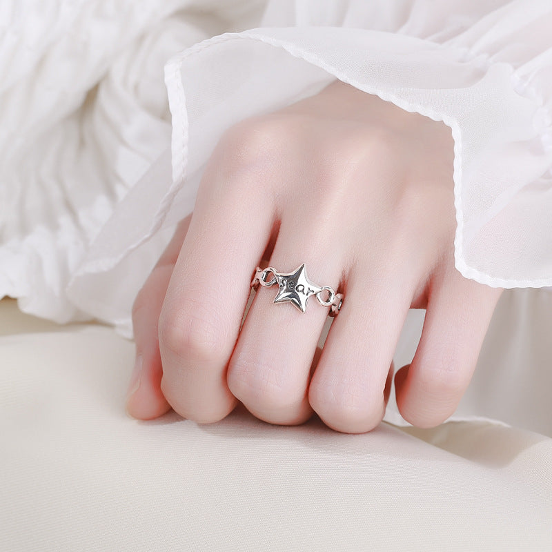 Women's ring with modern star design and engraved lettering Nin Boutique