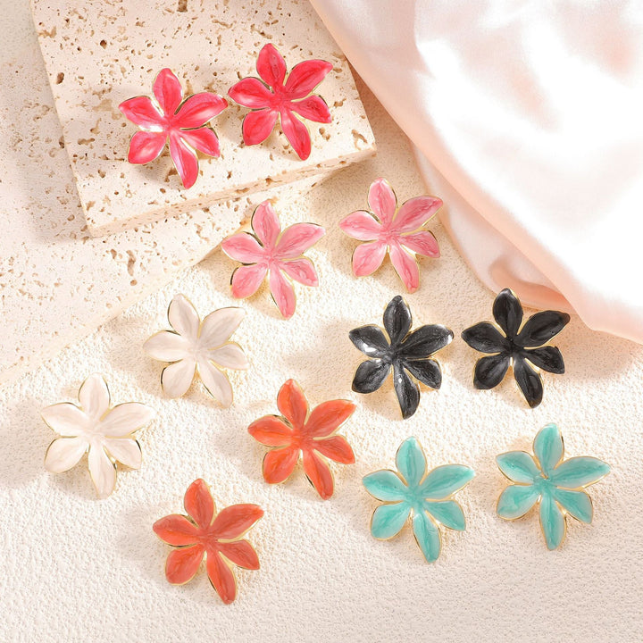 Ladies earrings with floral design and elegant gold rim Nin Boutique