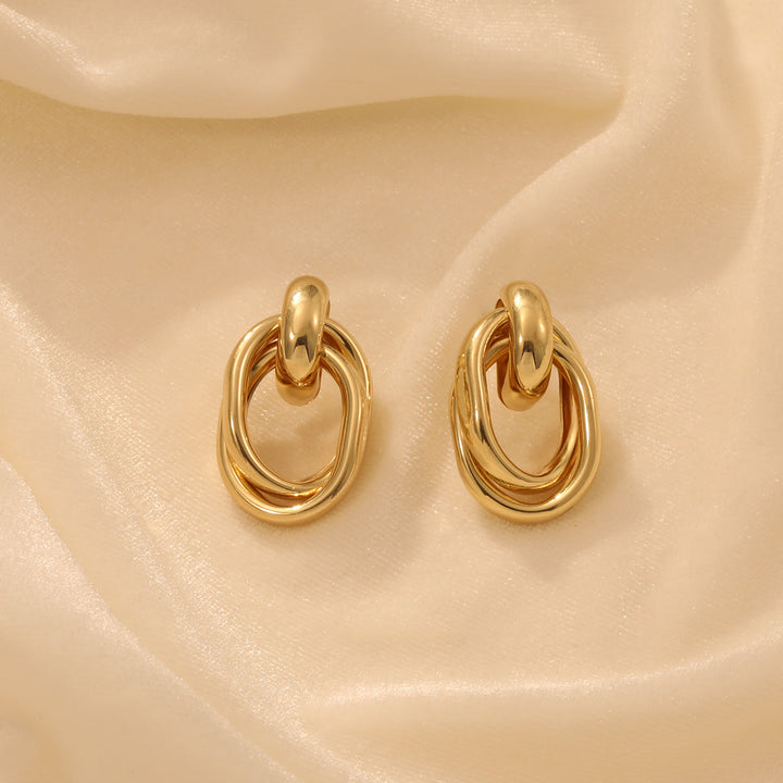 Ladies earrings with modern, curved design Nin Boutique