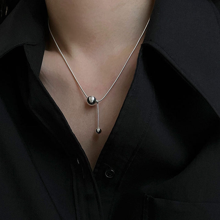 Women's necklace with modern, minimalist design and unique ball details Nin Boutique