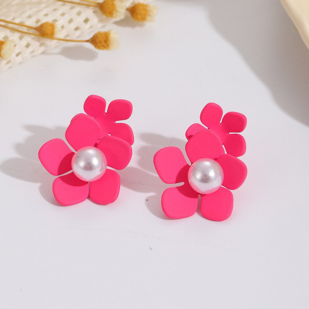 Women’s earrings with artistic floral motif and pearl accent Nin Boutique