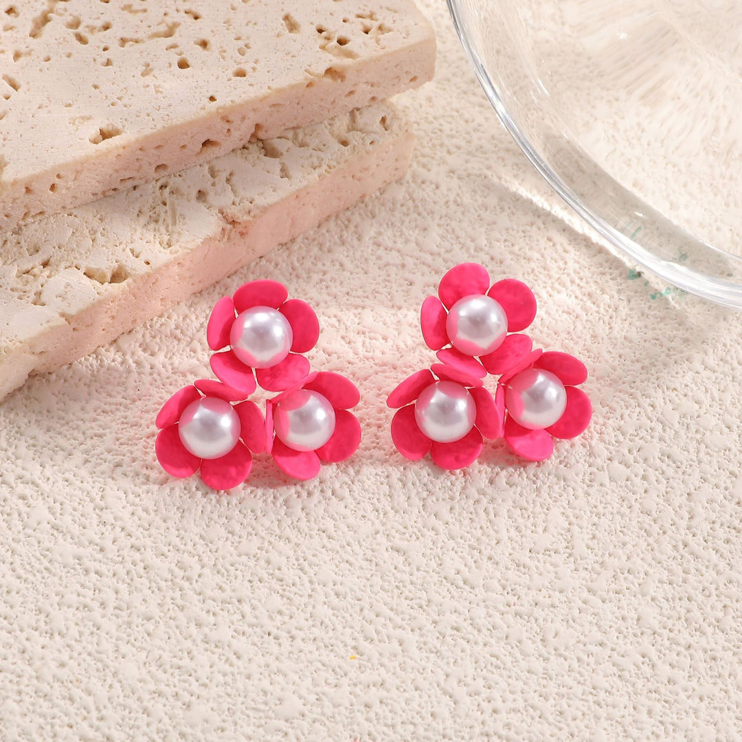 Ladies earrings in artistic floral style with pearl accent Nin Boutique