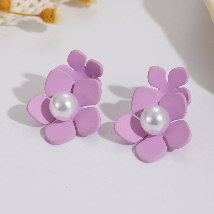 Women’s earrings with artistic floral motif and pearl accent Nin Boutique