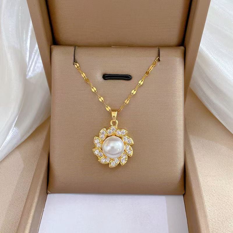 Women's luxury pearl halo cocktail ring with cubic zirconia petal accents and adjustable band Nin Boutique