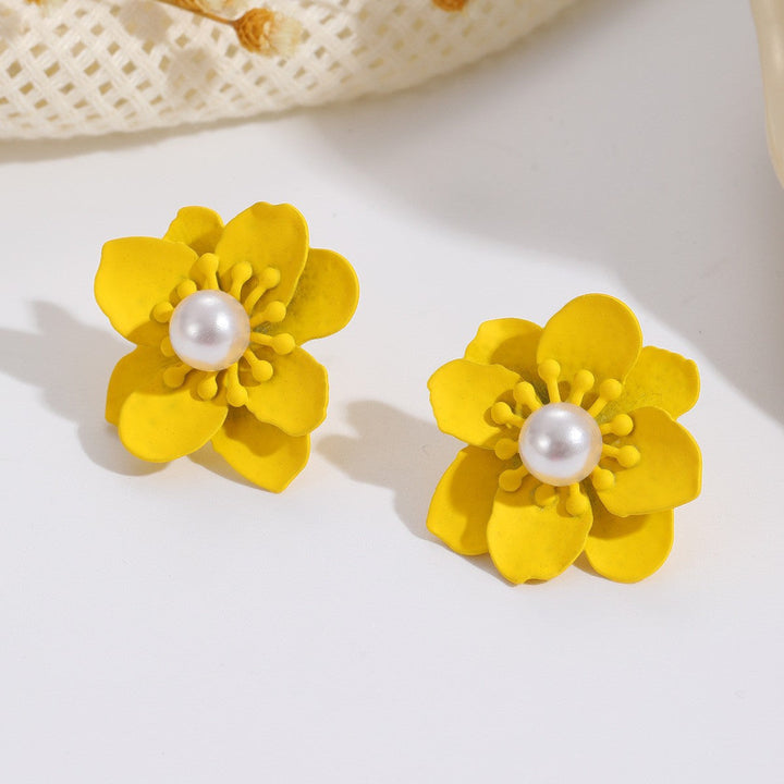 Women’s earrings with artistic floral motif and pearl accent Nin Boutique
