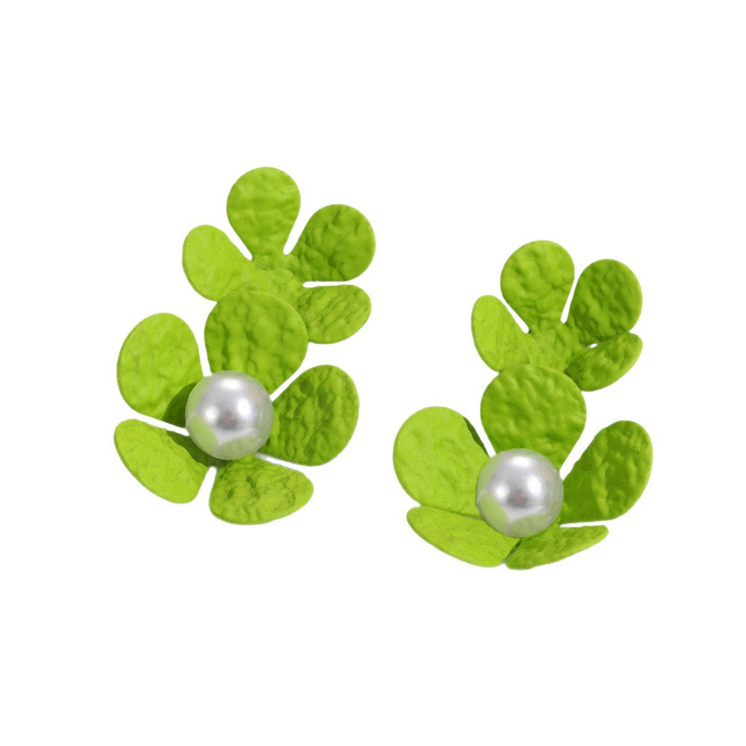 Ladies earrings with elaborate floral design and elegant pearl accents Nin Boutique
