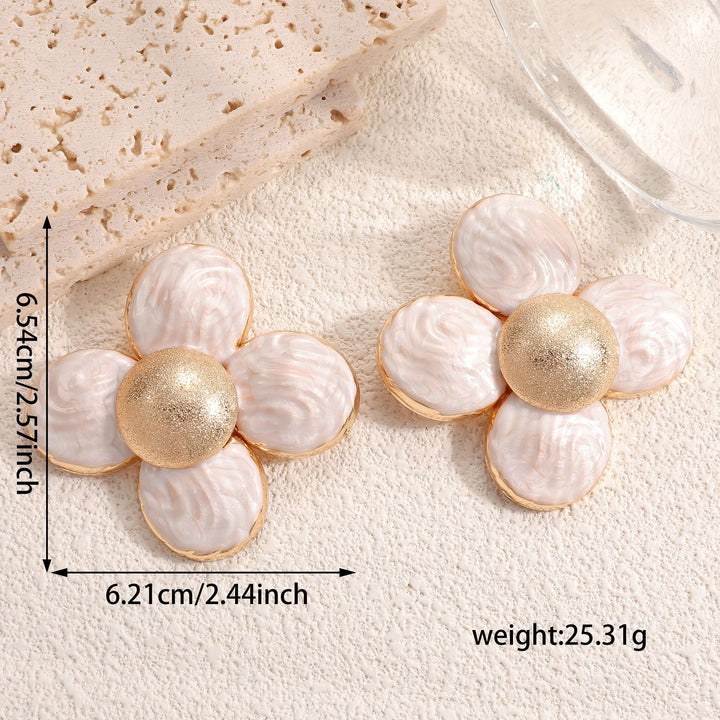 Ladies earrings in elaborate flower pattern Nin Boutique