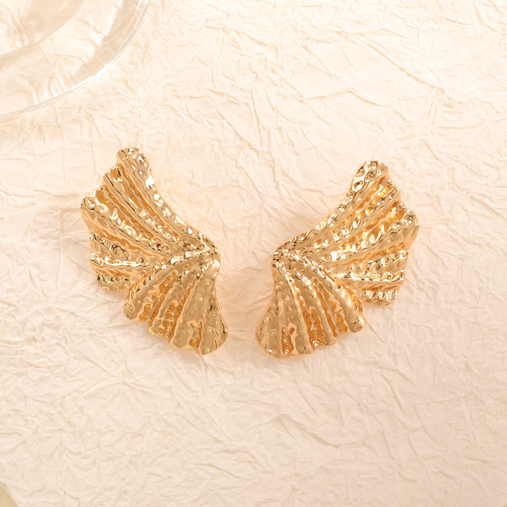 Ladies earrings with stylish shell design and antique finish Nin Boutique