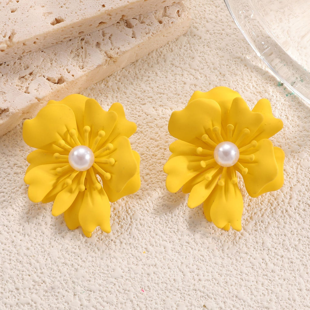 Ladies earrings with playful floral motif and pearl accent Nin Boutique