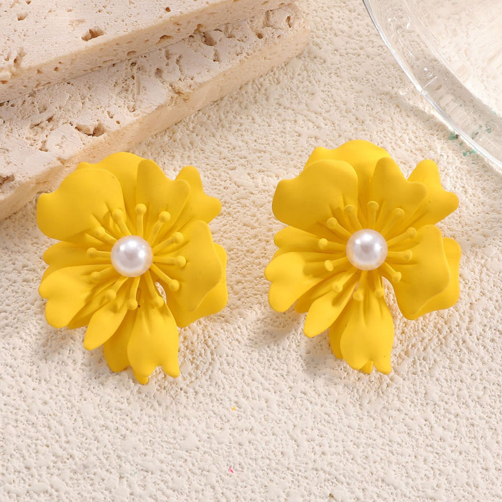 Ladies earrings with playful floral motif and pearl accent Nin Boutique