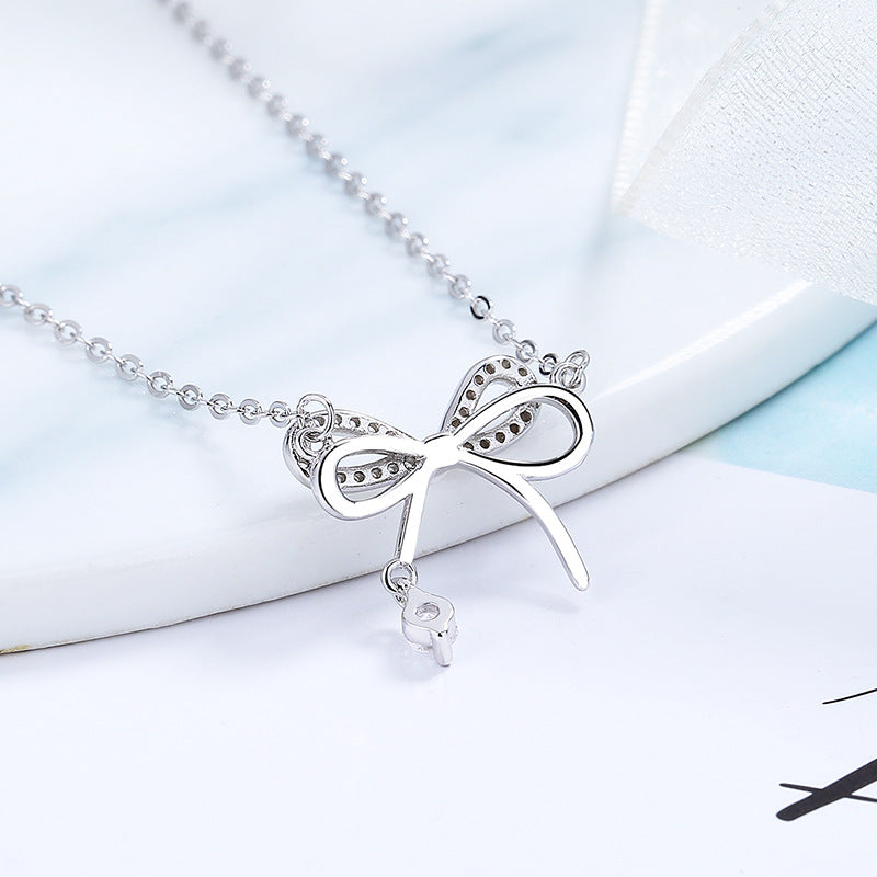 Women's necklace with intricate bow pendant and sparkling zirconia Nin Boutique