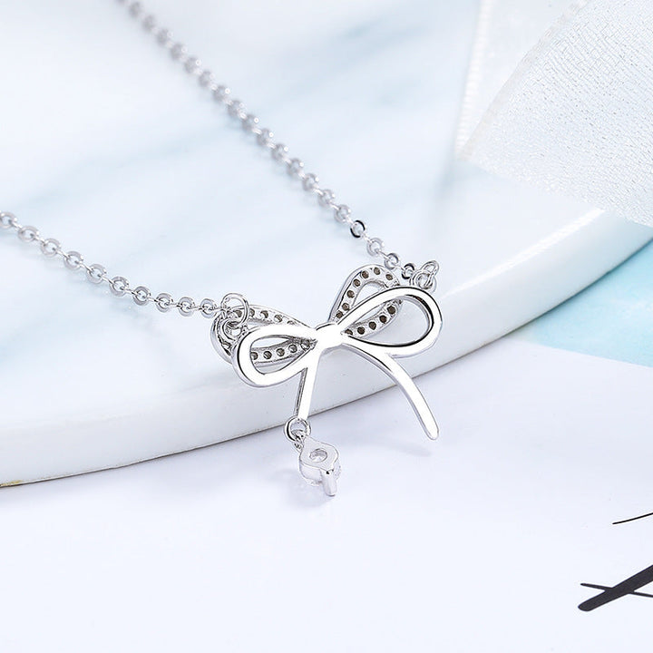Women's necklace with intricate bow pendant and sparkling zirconia Nin Boutique