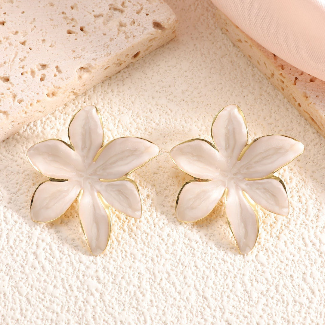 Ladies earrings with floral design and elegant gold rim Nin Boutique