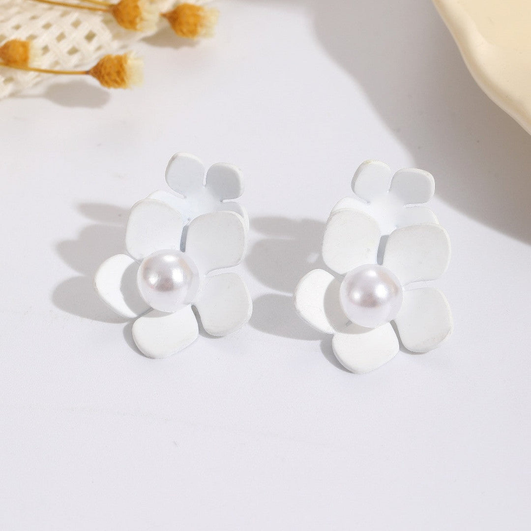 Women’s earrings with artistic floral motif and pearl accent Nin Boutique