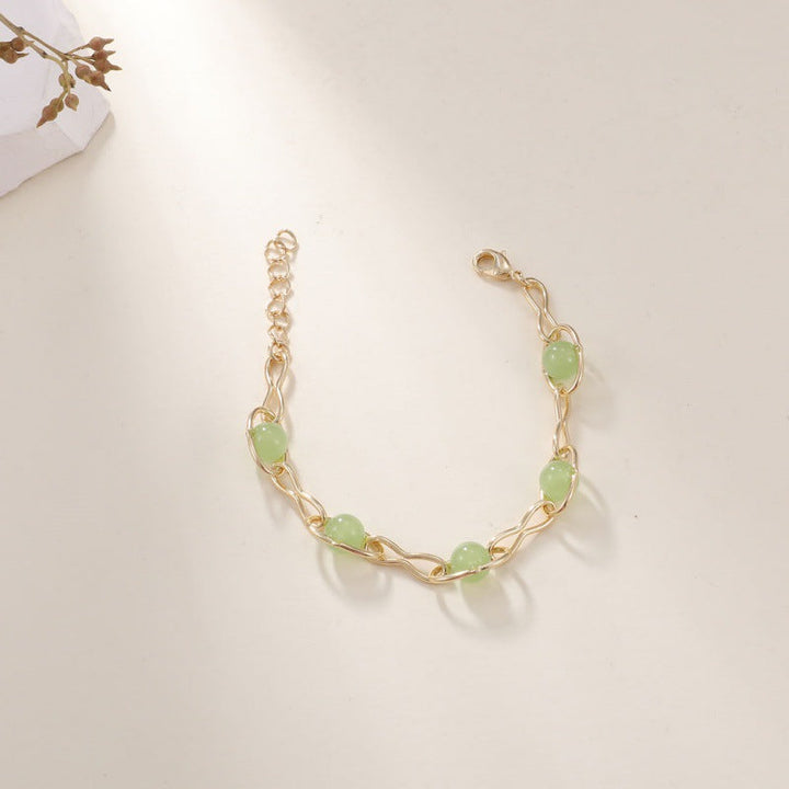 Ladies bracelet with intricately woven design and noble semi-precious stones Nin Boutique