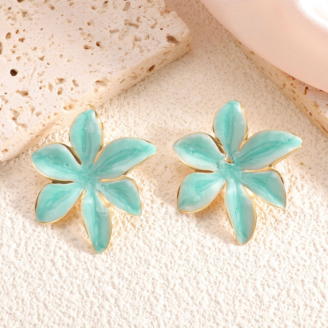 Ladies earrings with floral design and elegant gold rim Nin Boutique