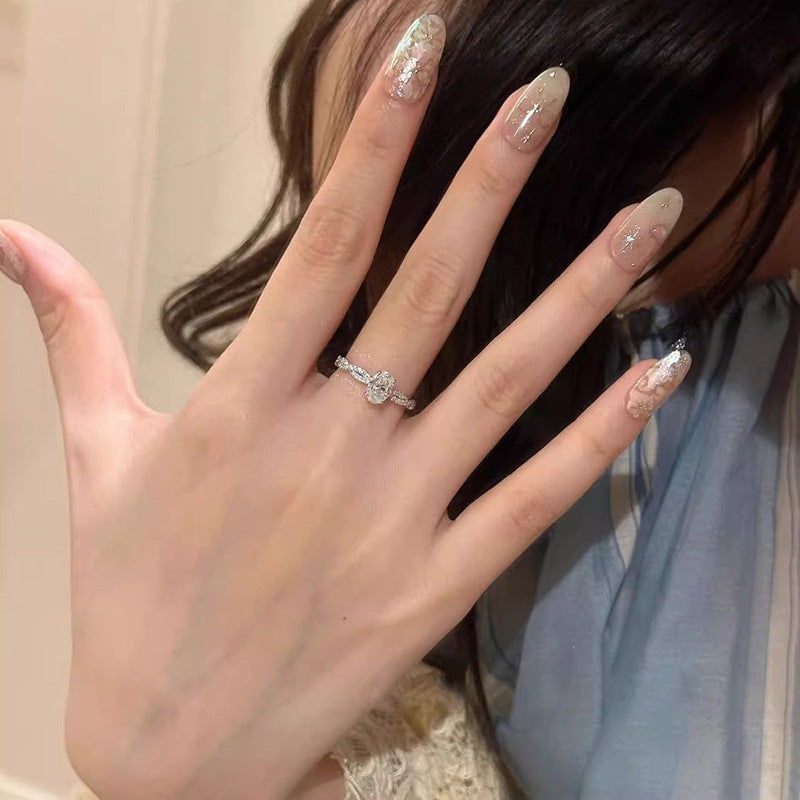 Ladies ring with sparkling zirconia and timeless wave pattern Nin Boutique