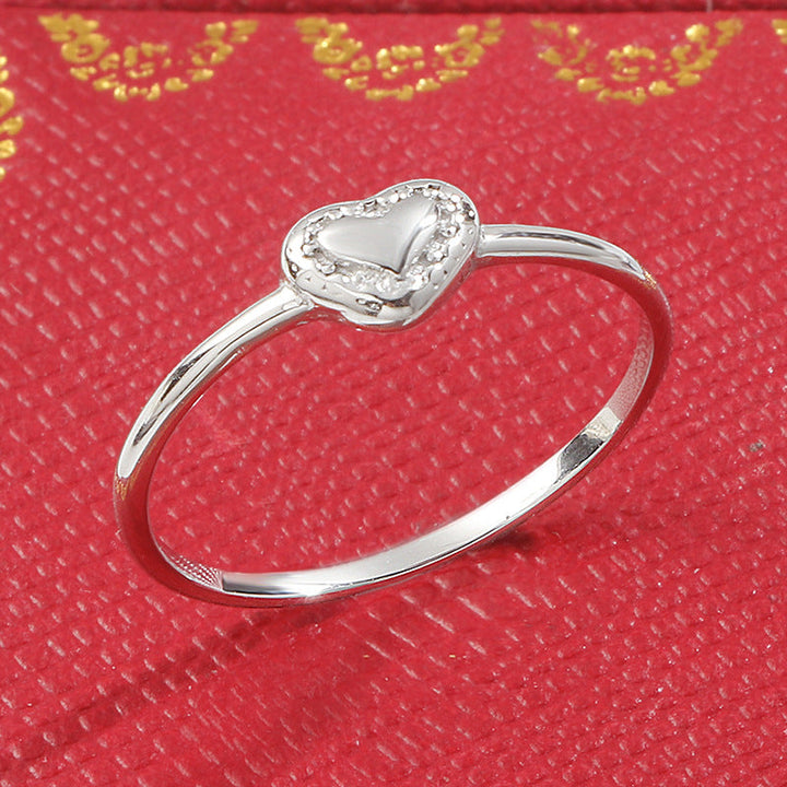 Ladies' delicate ring with heart-shaped design and sparkling accents Nin Boutique