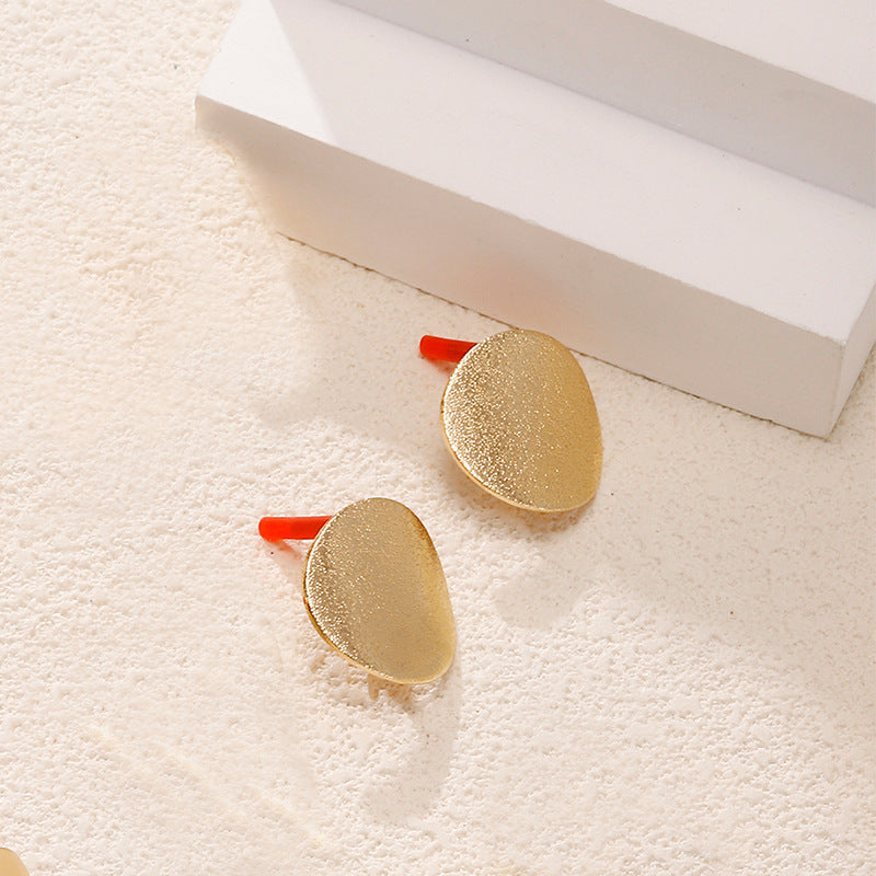 Ladies earrings in artistic face design Nin Boutique
