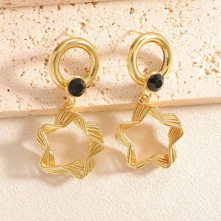 Ladies earrings with elaborate star design Nin Boutique