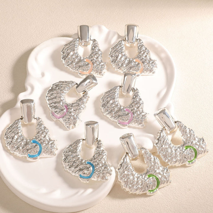 Women's earrings in artistic relief design Nin Boutique