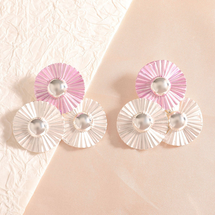 Ladies earrings with intricate fold design and shimmering accents Nin Boutique