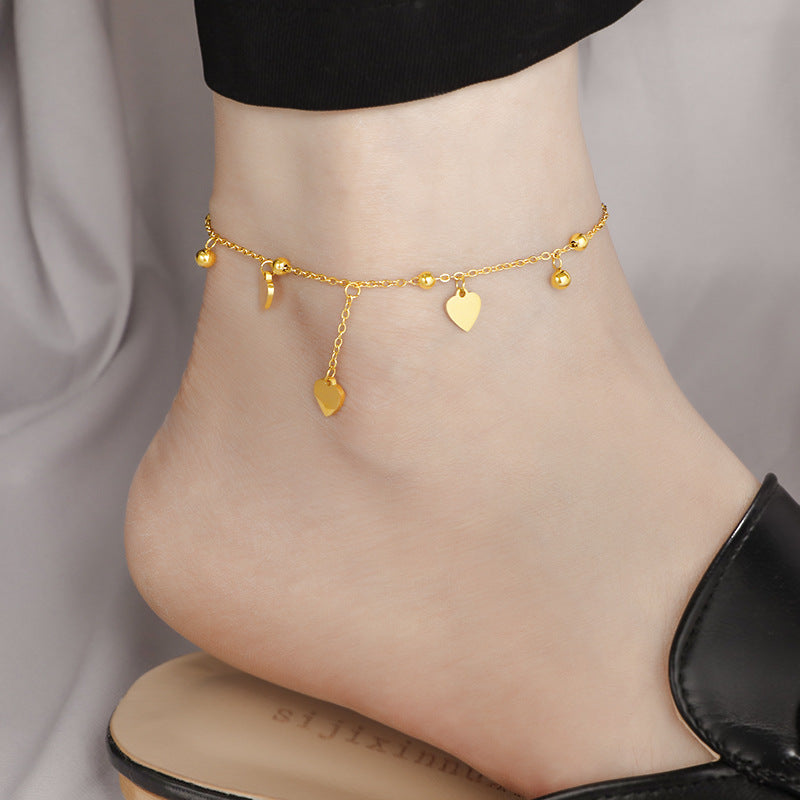 Ladies delicate ankle bracelet with heart-shaped pendants and shiny ball details Nin Boutique