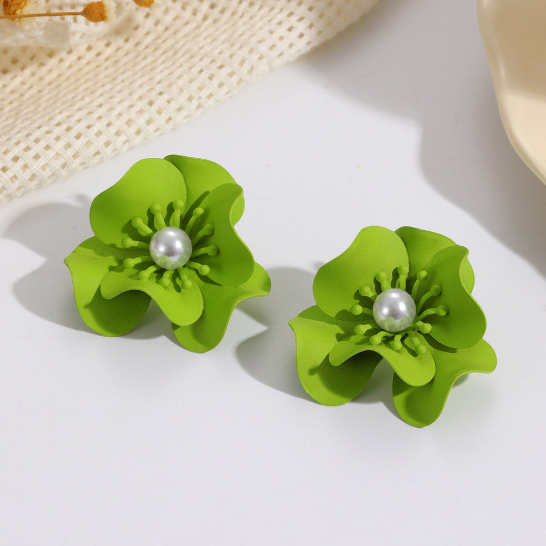Women's earrings with intricate floral design and pearl accent Nin Boutique