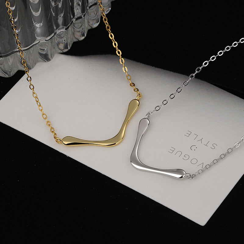 Women's necklace with modern, curved pendant Nin Boutique